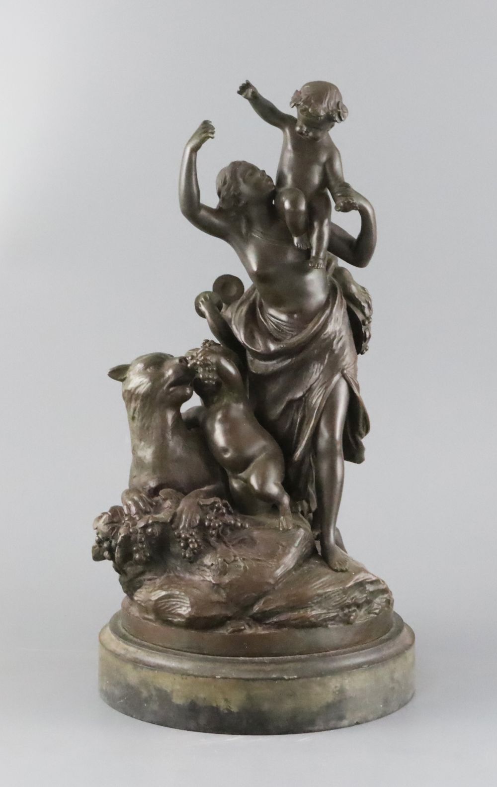 After Clodion. A bronze group of a mother, three putti and a panther, on naturalistic base and slate plinth, height 37.5cm